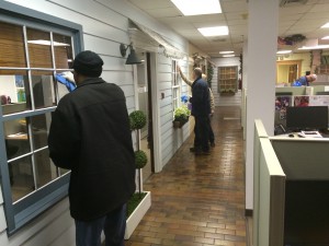 Workers cleaning windows at CHOICE as part of the jobs training program