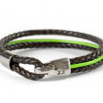 A green and brown rope bracelet that says be brave