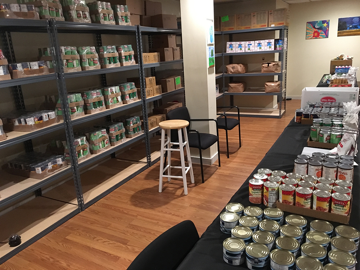 The CHOICE food pantry with shelves full of canned goods
